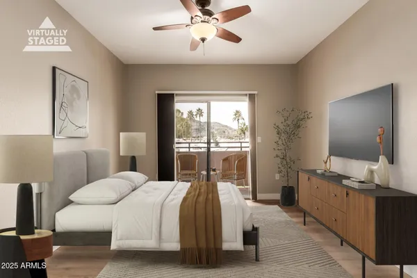 a bedroom with a bed and large window