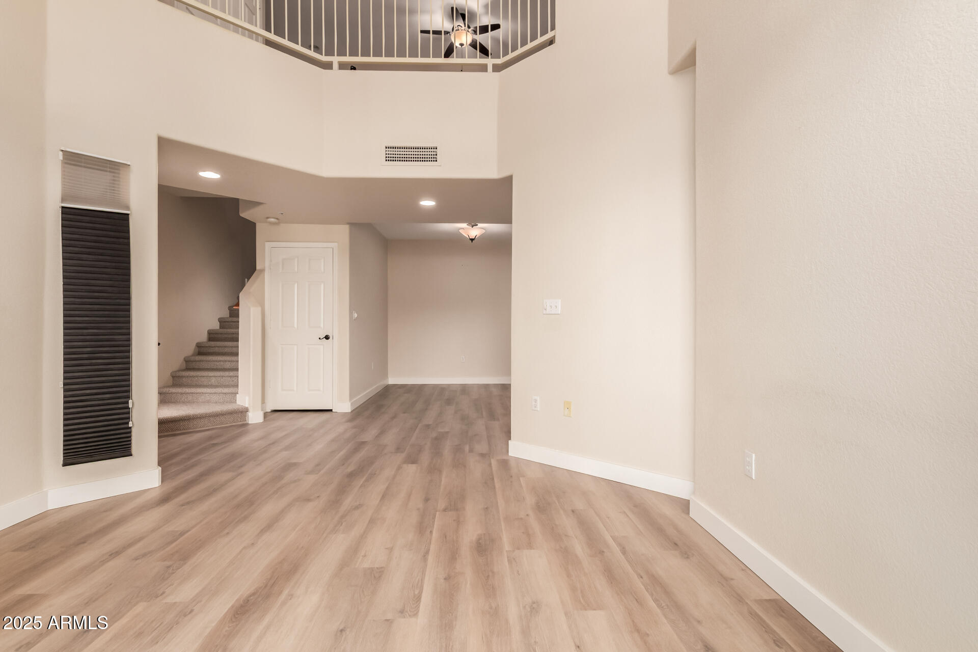 10410 North Cave Creek Road, Unit 2006 Phoenix, AZ 85020 - Photo 24 of 29 a view of a hallway with wooden floor