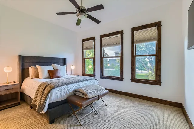 a bed room with a bed and a window