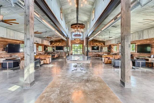 a living room with fireplace furniture and a flat screen tv