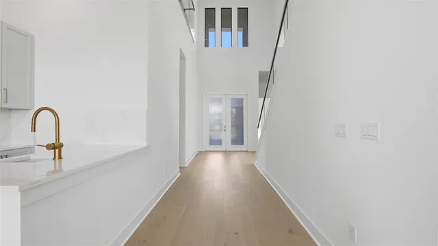 a view of a hallway with a sink