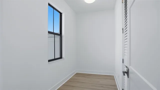 a view of a small space with wooden floor