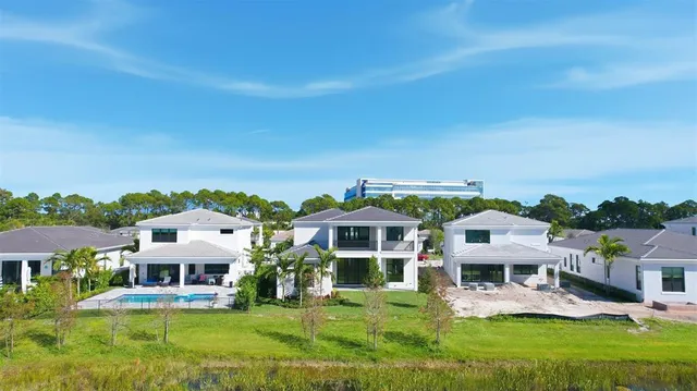 an aerial view of a house with a big yard