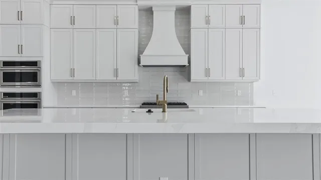a kitchen with a sink and cabinets