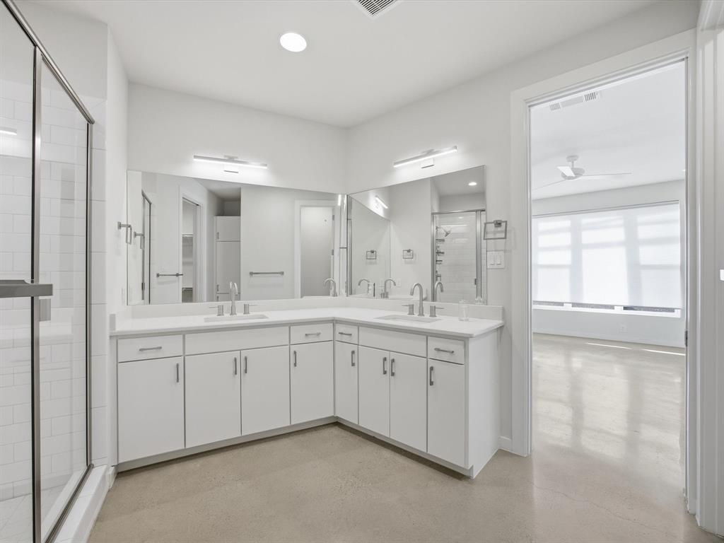 2802 Lee Street Dallas, TX 75206 - Photo 18 of 40 a spacious bathroom with a granite countertop sink mirror and