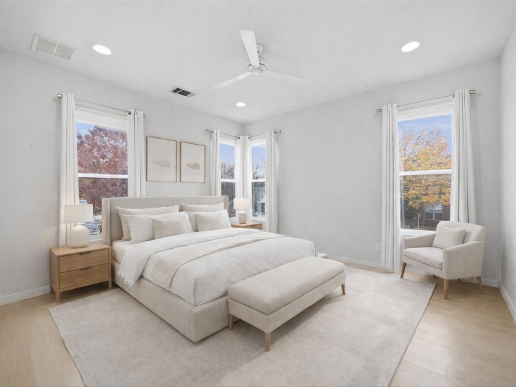 2802 Lee Street Dallas, TX 75206 - Photo 20 of 40 a bedroom with a large bed and a couch