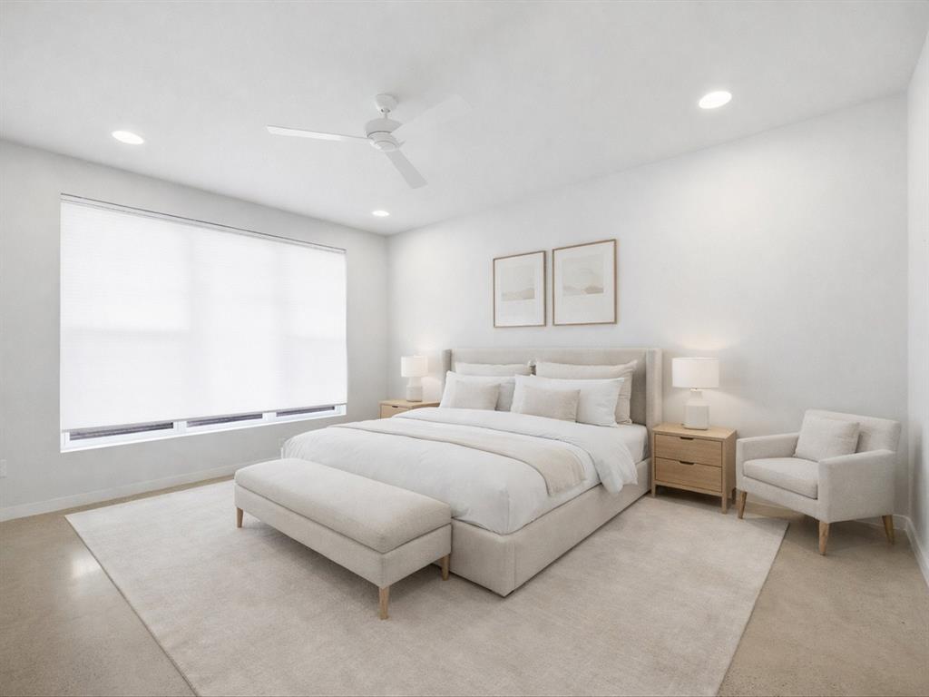 2802 Lee Street Dallas, TX 75206 - Photo 21 of 40 a spacious bedroom with a bed and a large window