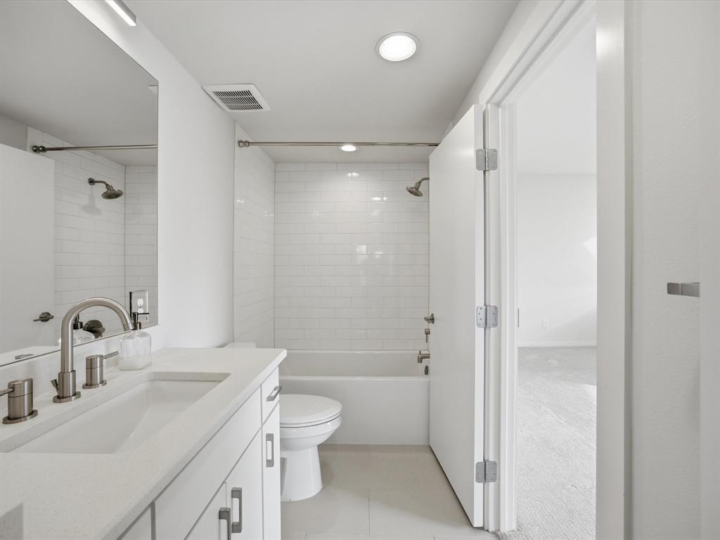 2802 Lee Street Dallas, TX 75206 - Photo 26 of 40 a bathroom with a sink toilet and shower