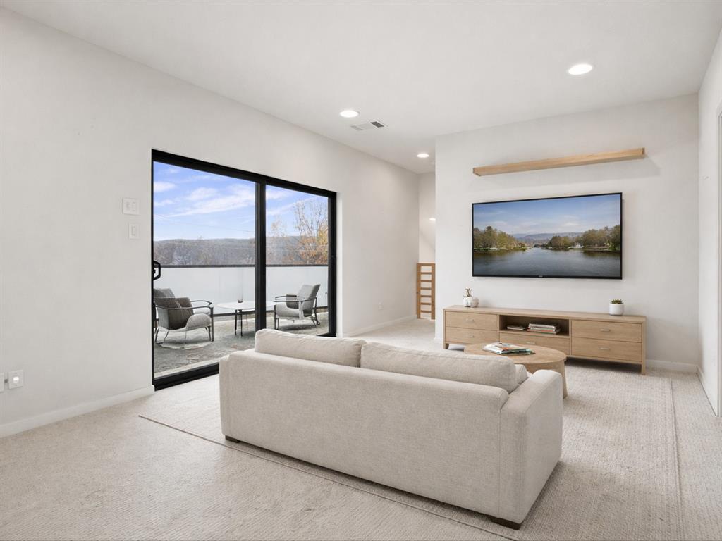 2802 Lee Street Dallas, TX 75206 - Photo 29 of 40 a living room with furniture and a flat screen tv