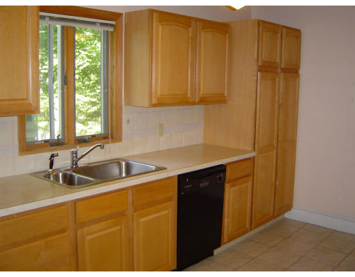 9-11 Fordham Road Newton, MA 02465 - Photo 3 of 8 a kitchen with a sink and a window
