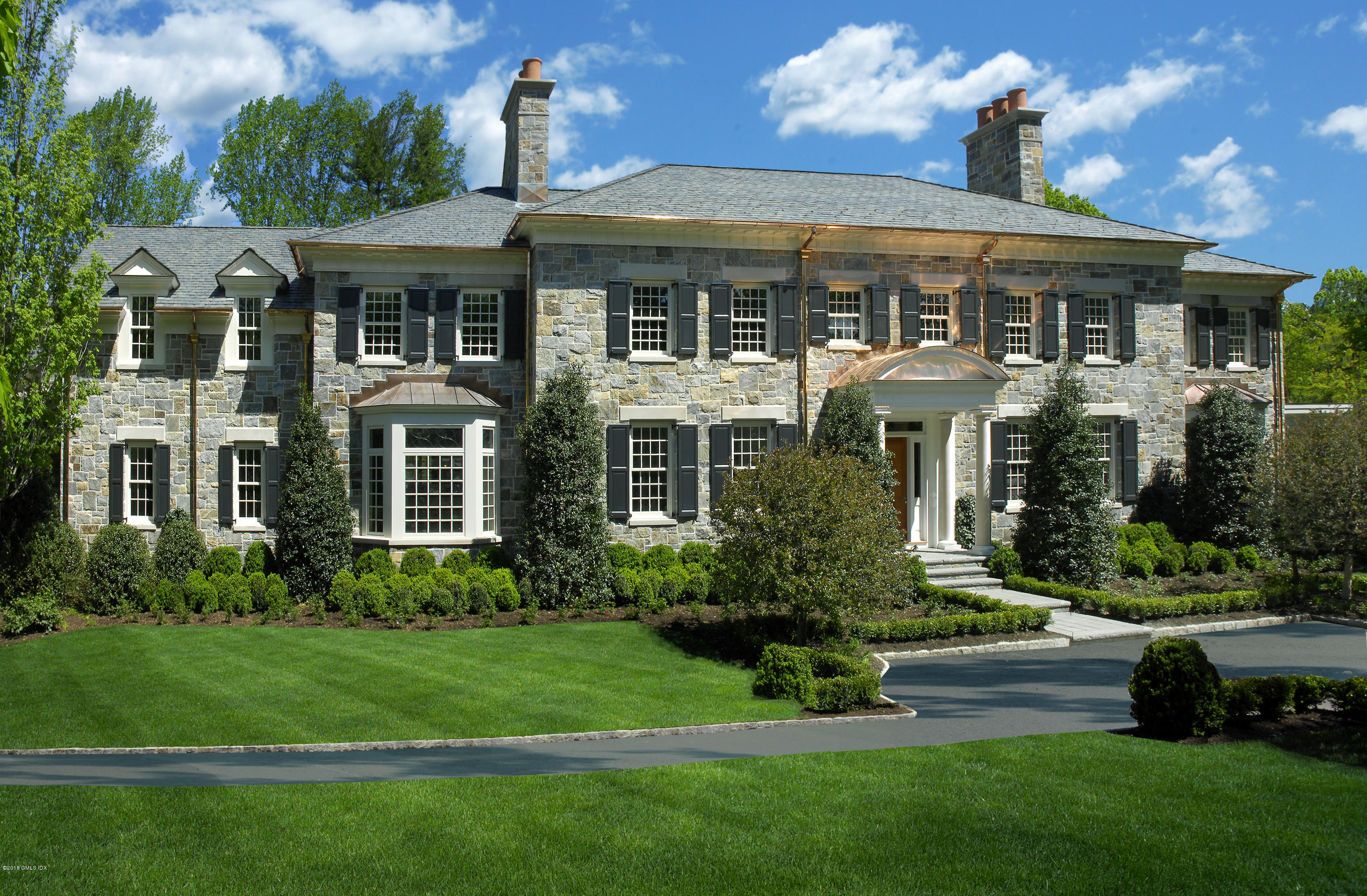 2 Deer Park Meadow Road Greenwich, CT 06830 - Photo 1 of 28 a front view of a house with a yard