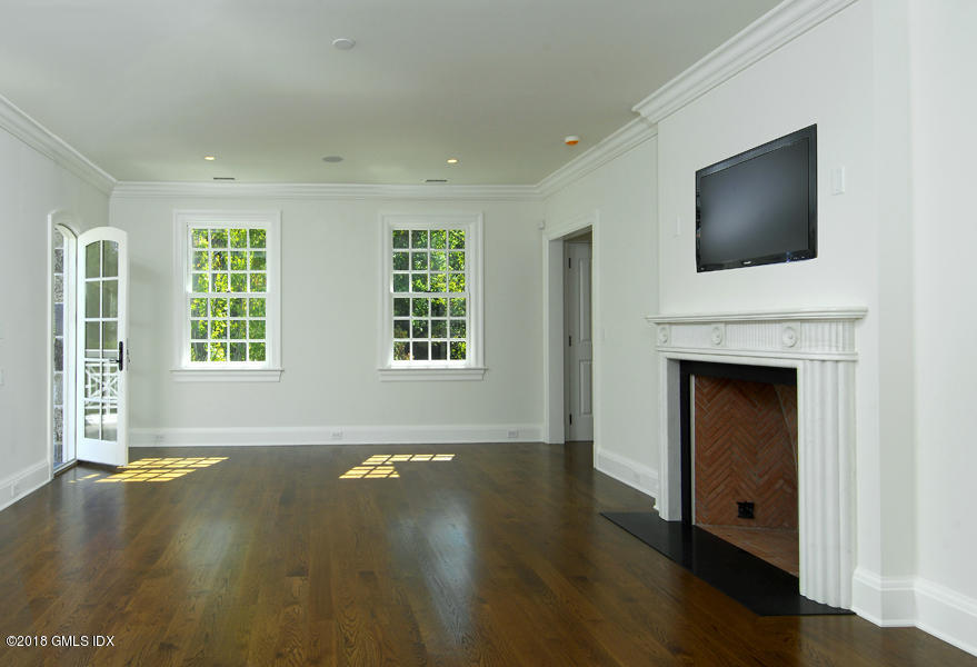 2 Deer Park Meadow Road Greenwich, CT 06830 - Photo 15 of 28 a view of an empty room with wooden floor and a window