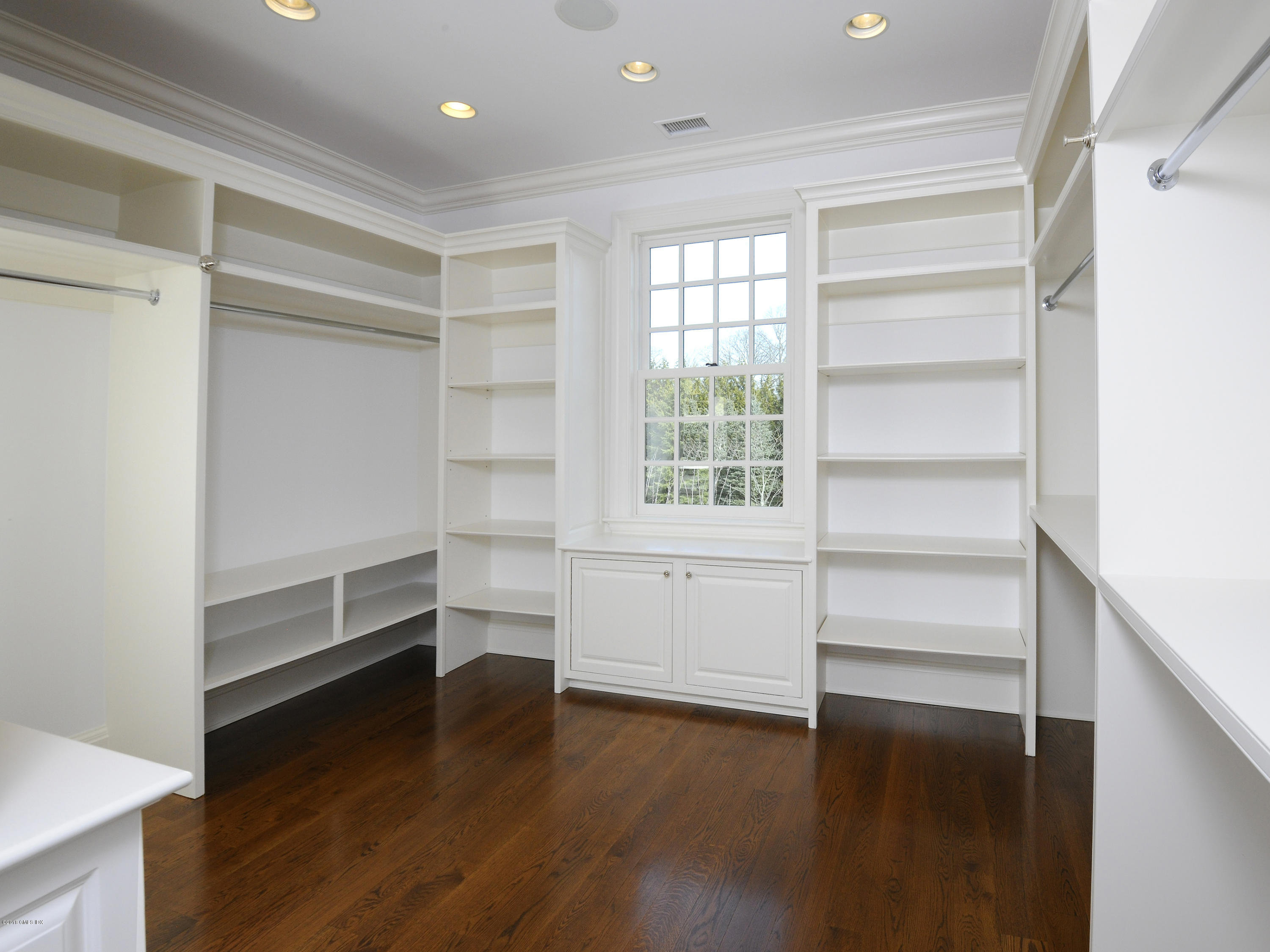 2 Deer Park Meadow Road Greenwich, CT 06830 - Photo 20 of 28 a view of an empty room with a window and wooden floor