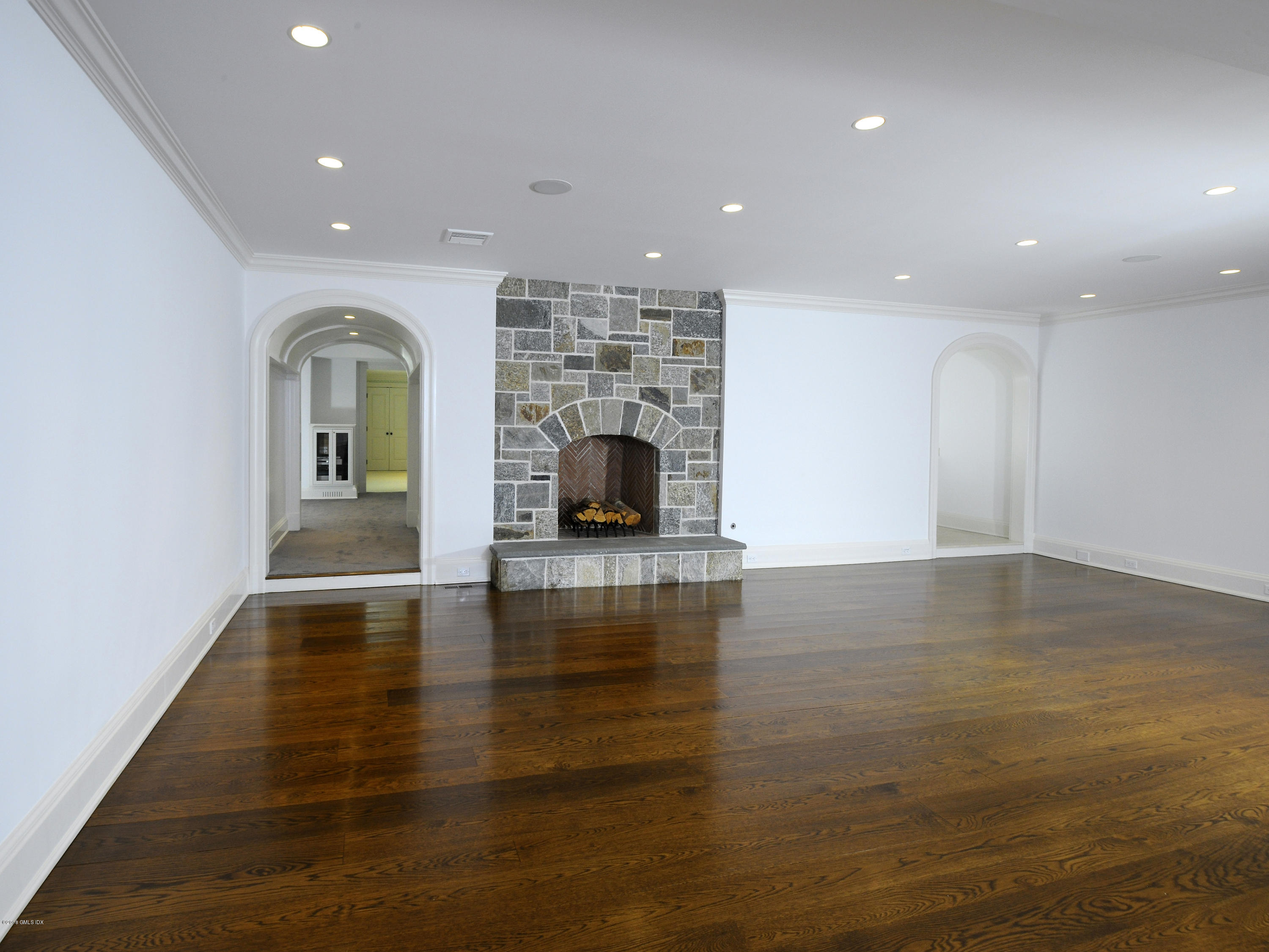 2 Deer Park Meadow Road Greenwich, CT 06830 - Photo 21 of 28 a view of a living room a fireplace with wooden floor