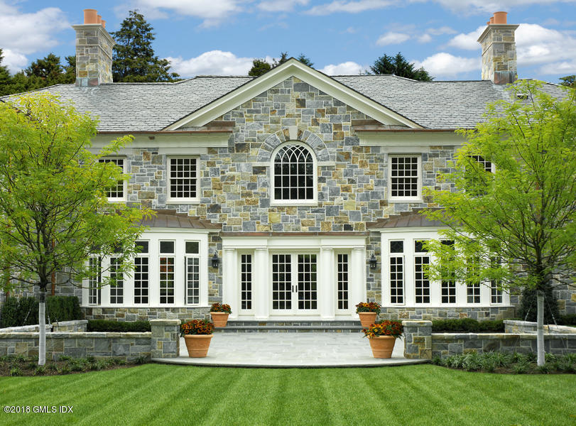 2 Deer Park Meadow Road Greenwich, CT 06830 - Photo 23 of 28 front view of a house with a yard