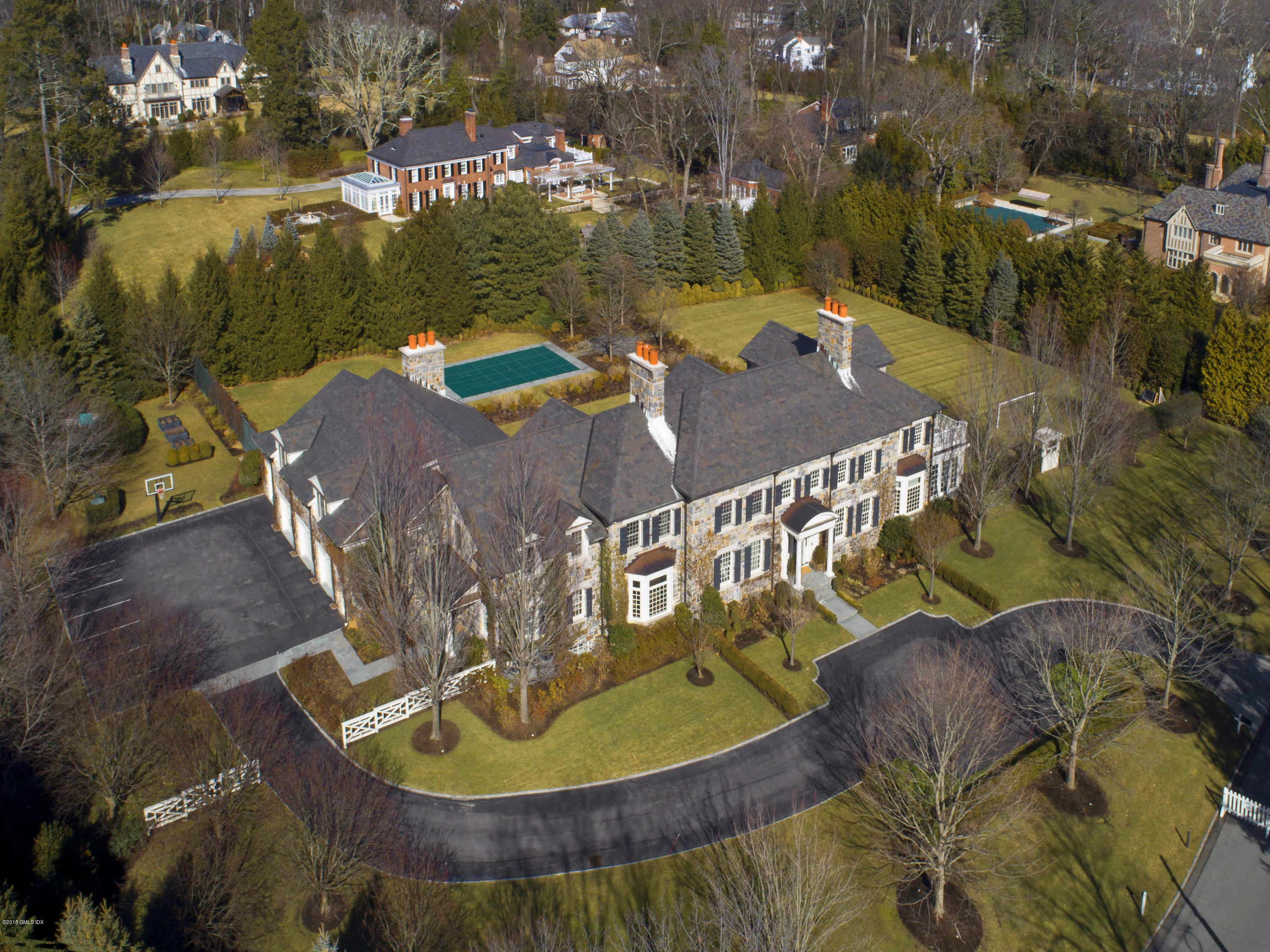 2 Deer Park Meadow Road Greenwich, CT 06830 - Photo 28 of 28 a view of a swimming pool with a patio