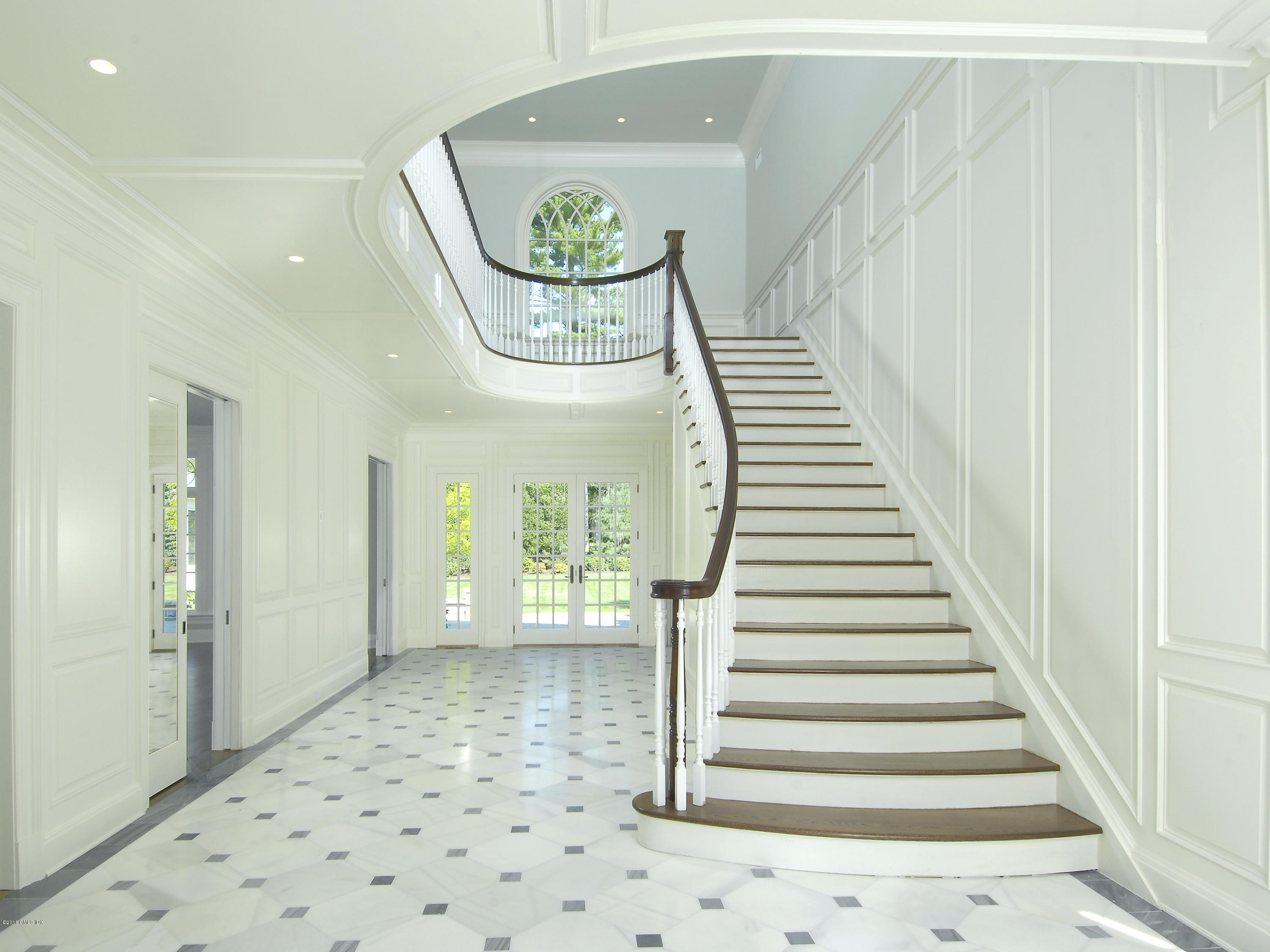 2 Deer Park Meadow Road Greenwich, CT 06830 - Photo 3 of 28 a view of a hallway with wooden floor and staircase