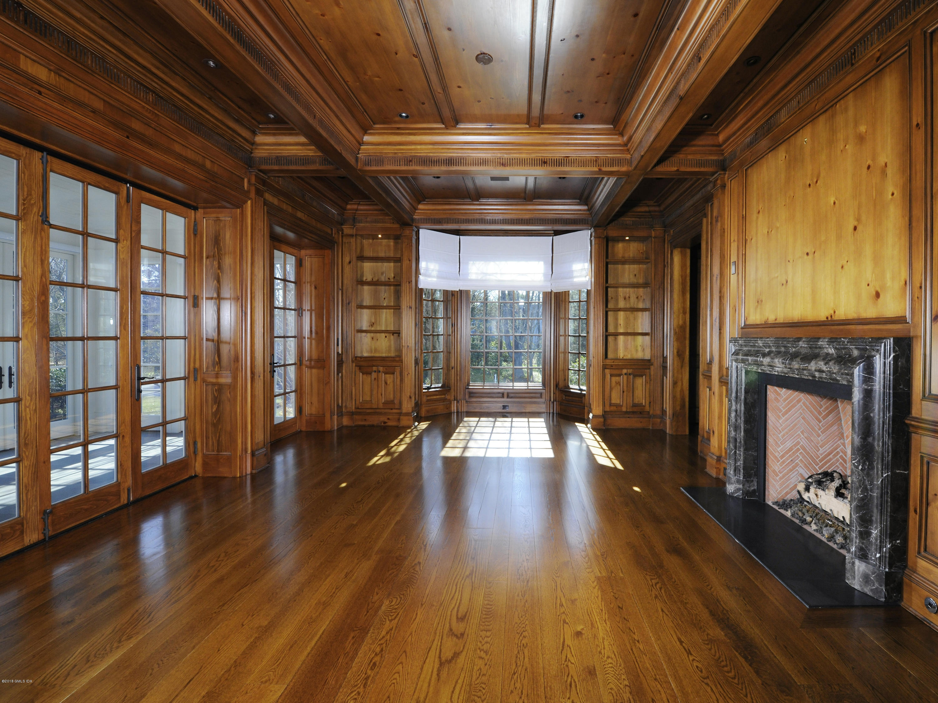 2 Deer Park Meadow Road Greenwich, CT 06830 - Photo 7 of 28 a view of an empty room with wooden floor and a window