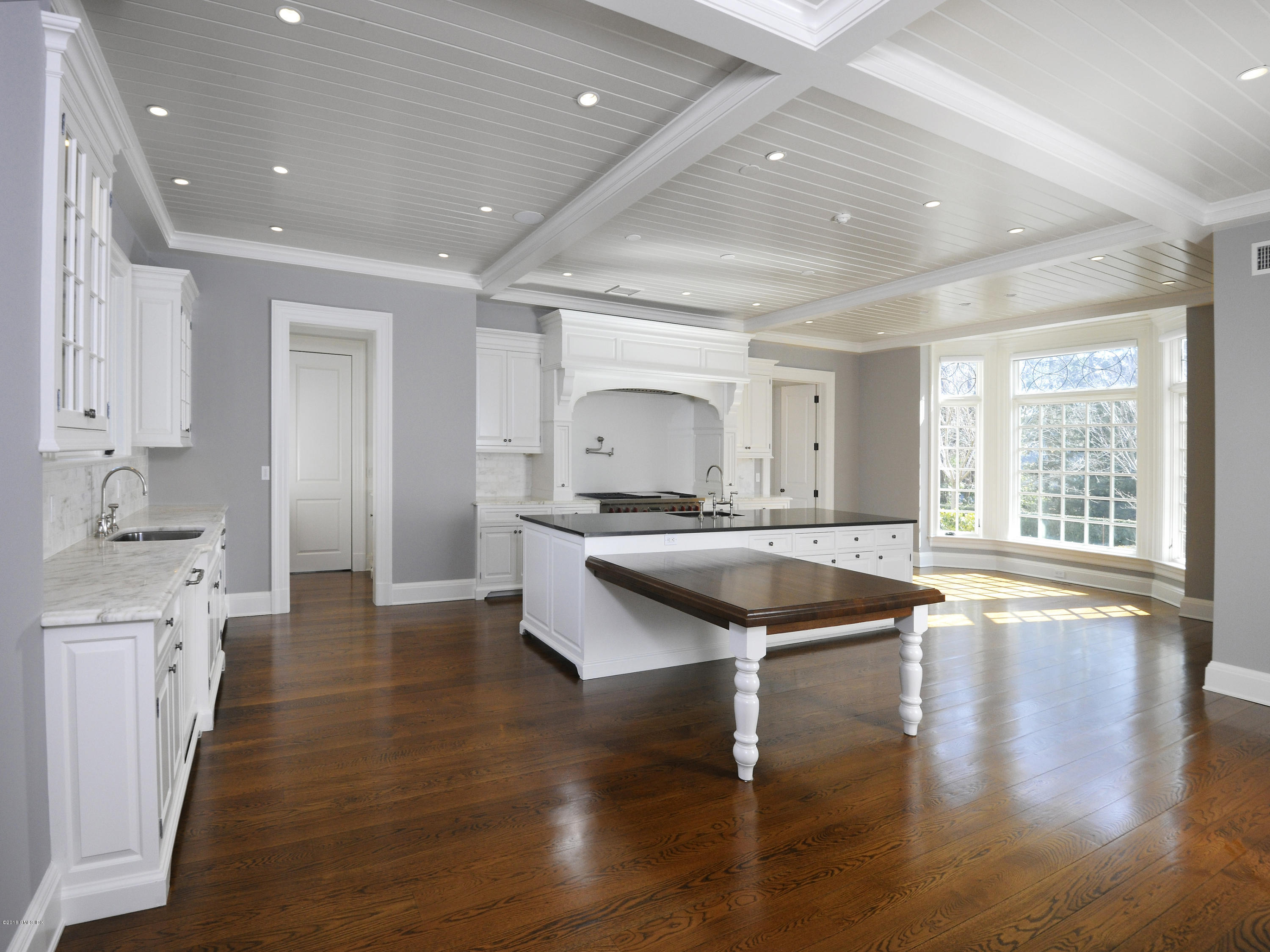 2 Deer Park Meadow Road Greenwich, CT 06830 - Photo 10 of 28 a large kitchen with stainless steel appliances granite countertop a lot of counter space and wooden floor