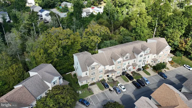 aerial view of a house with patio outdoor seating and plants
