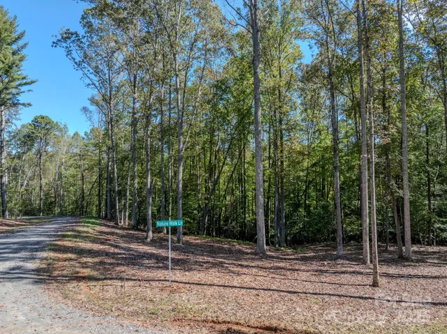 a wooden house with large trees