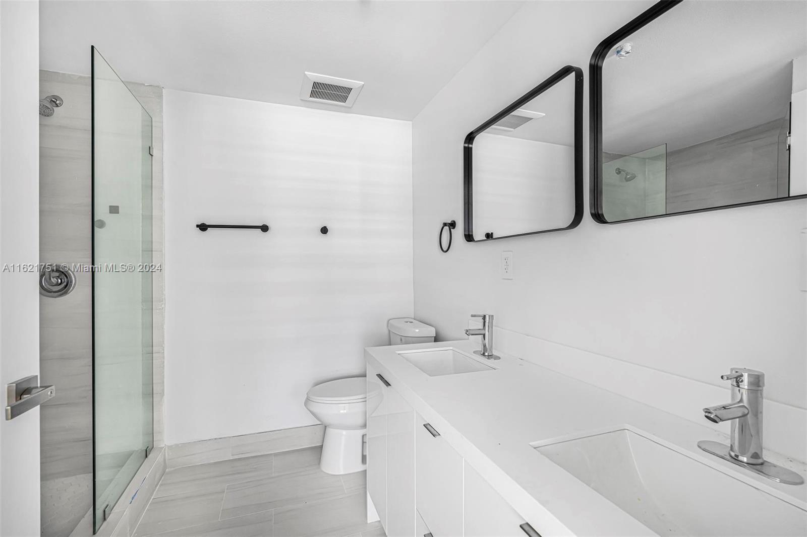 16955 Southwest 100th Avenue Miami, FL 33157 - Photo 22 of 36 a bathroom with a sink a toilet and shower