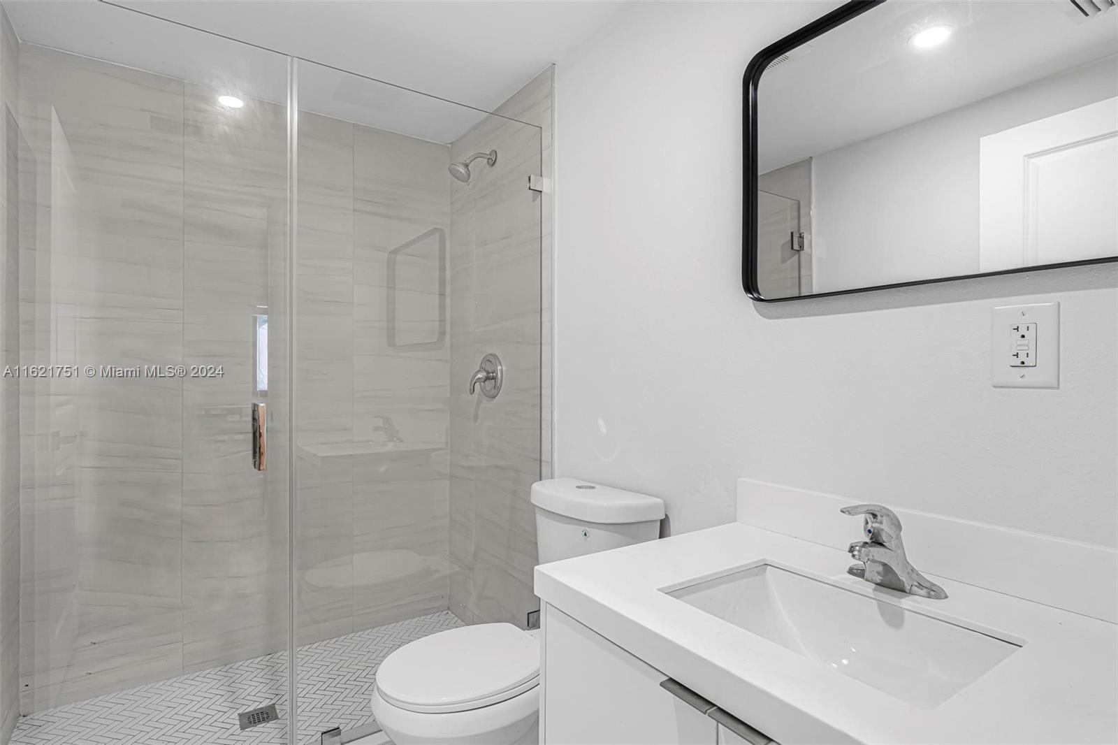 16955 Southwest 100th Avenue Miami, FL 33157 - Photo 24 of 36 a bathroom with a sink toilet and shower