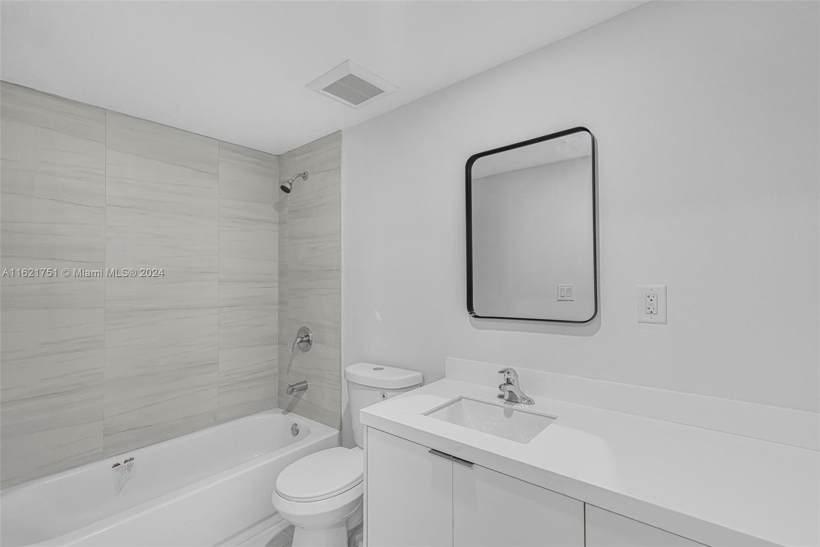 16955 Southwest 100th Avenue Miami, FL 33157 - Photo 26 of 36 a bathroom with a bathtub shower sink mirror and toilet