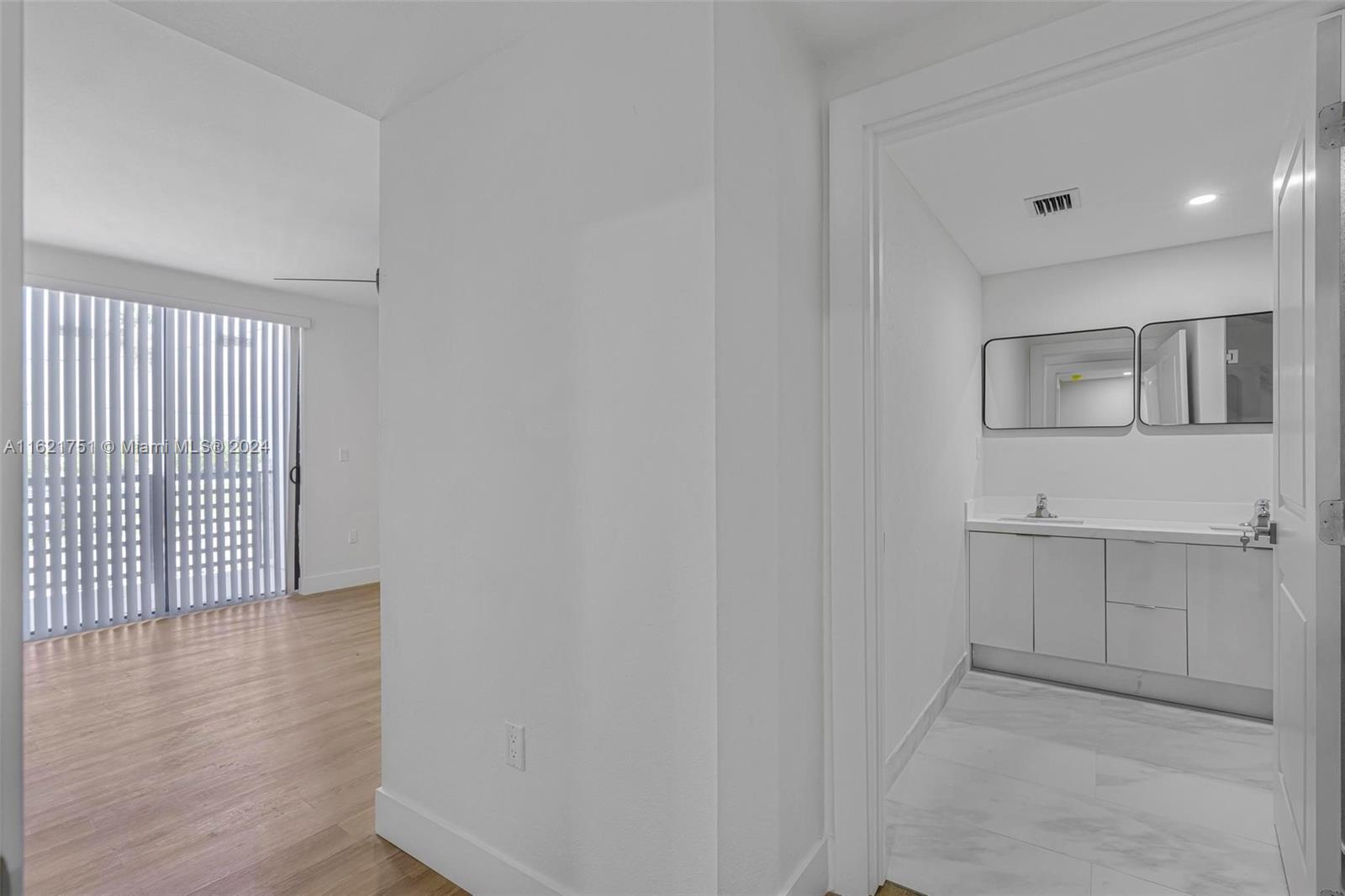 16955 Southwest 100th Avenue Miami, FL 33157 - Photo 28 of 36 a view of hallway with wooden floor