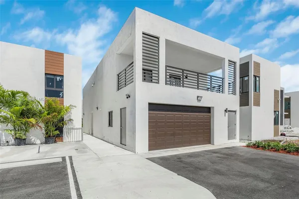 a front view of a house with a garage