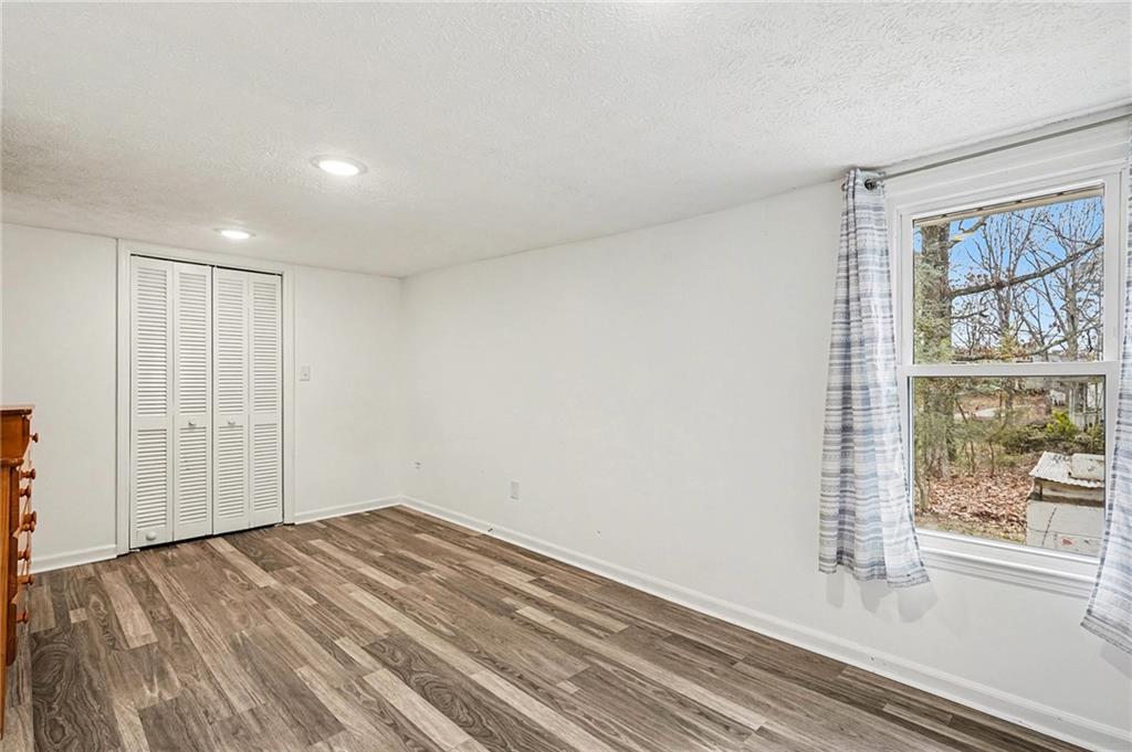 360 Ridge Road Canton, GA 30114 - Photo 12 of 16 a view of empty room with wooden floor and fan