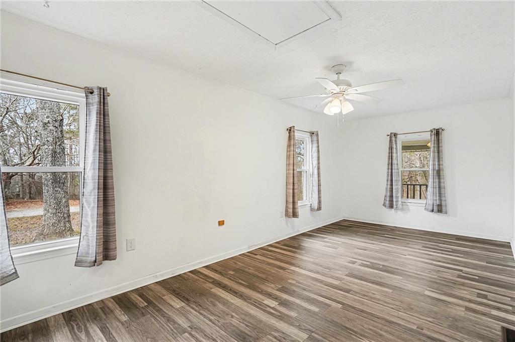 360 Ridge Road Canton, GA 30114 - Photo 13 of 16 a view of an empty room with a window and wooden floor
