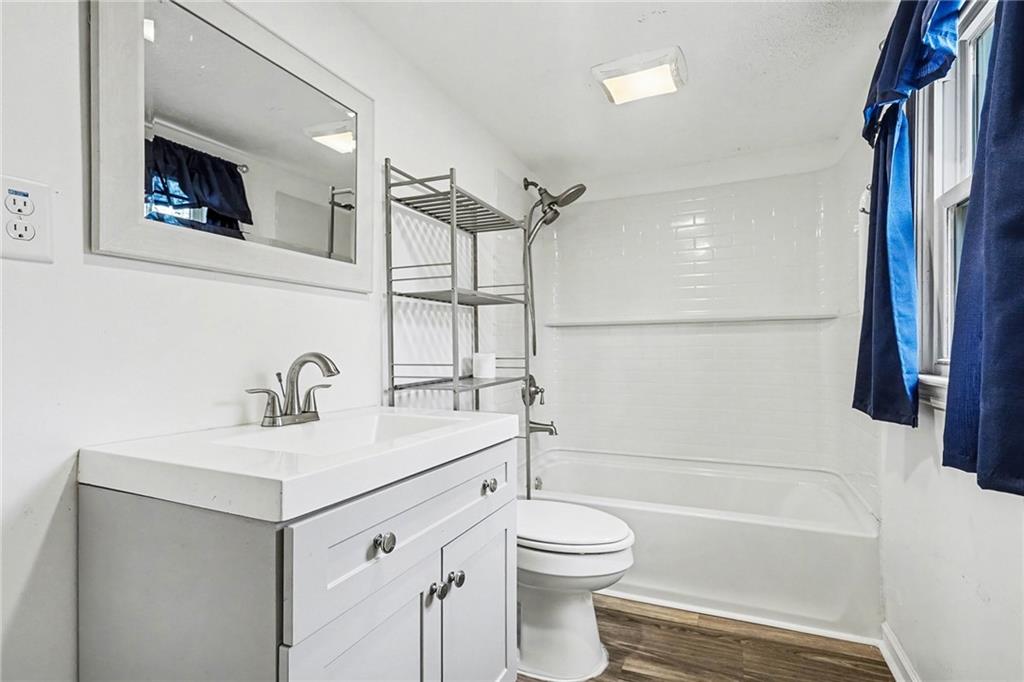 360 Ridge Road Canton, GA 30114 - Photo 14 of 16 a bathroom with a sink a toilet and a bathtub
