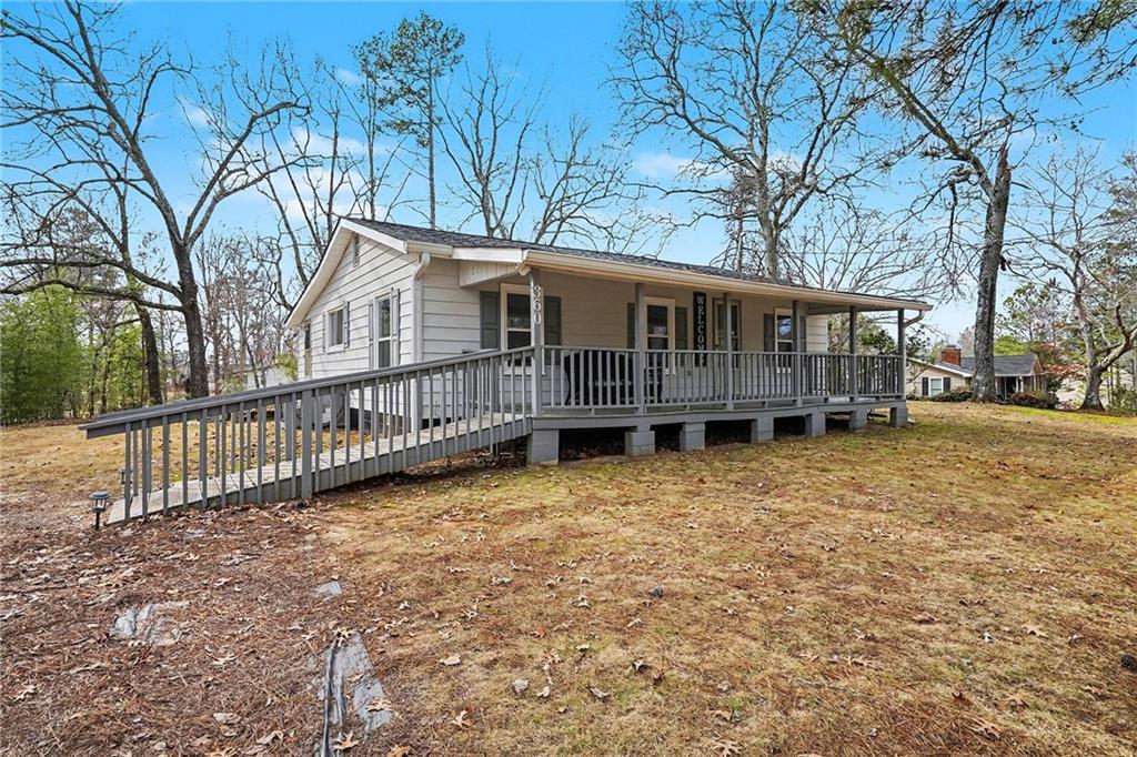 360 Ridge Road Canton, GA 30114 - Photo 3 of 16 a view of a house with wooden floor next to a yard