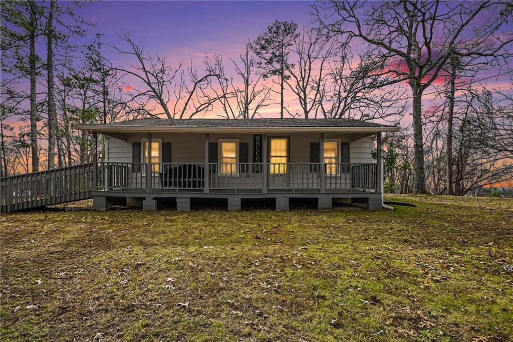 360 Ridge Road Canton, GA 30114 - Photo 4 of 16 a house with trees in the background