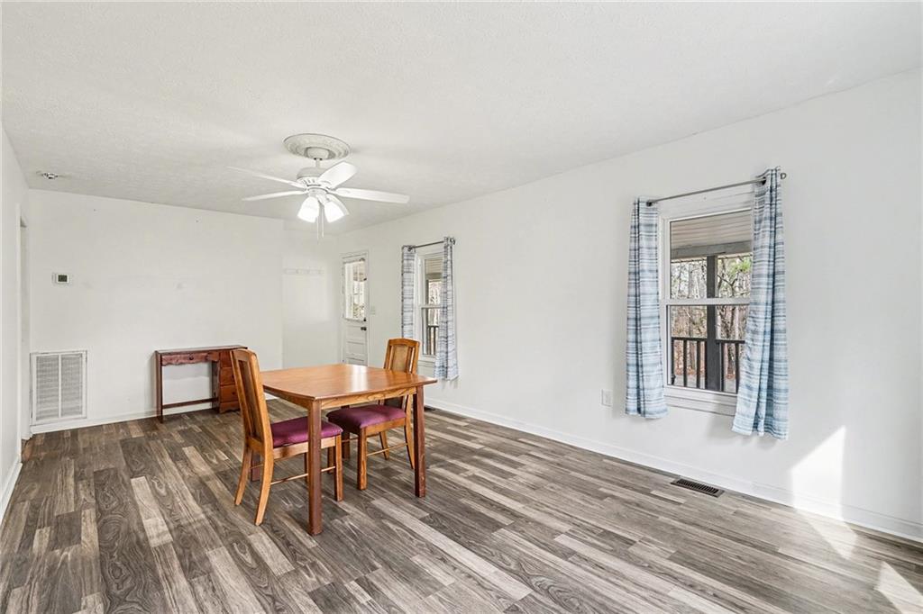 360 Ridge Road Canton, GA 30114 - Photo 5 of 16 a view of a dining room with furniture and wooden floor