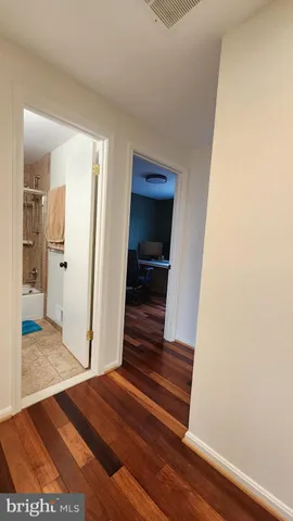 a view of front door with wooden floor