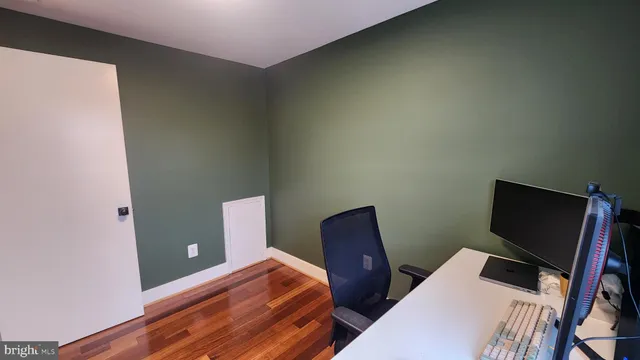 a view of a workspace with furniture