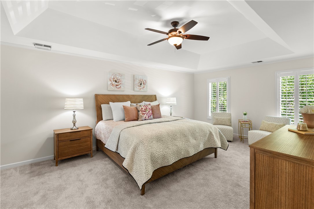 312 English Oak Road Simpsonville, SC 29681 - Photo 19 of 48 This tranquil primary bedroom offers a serene retreat with elegant details and abundant natural light.