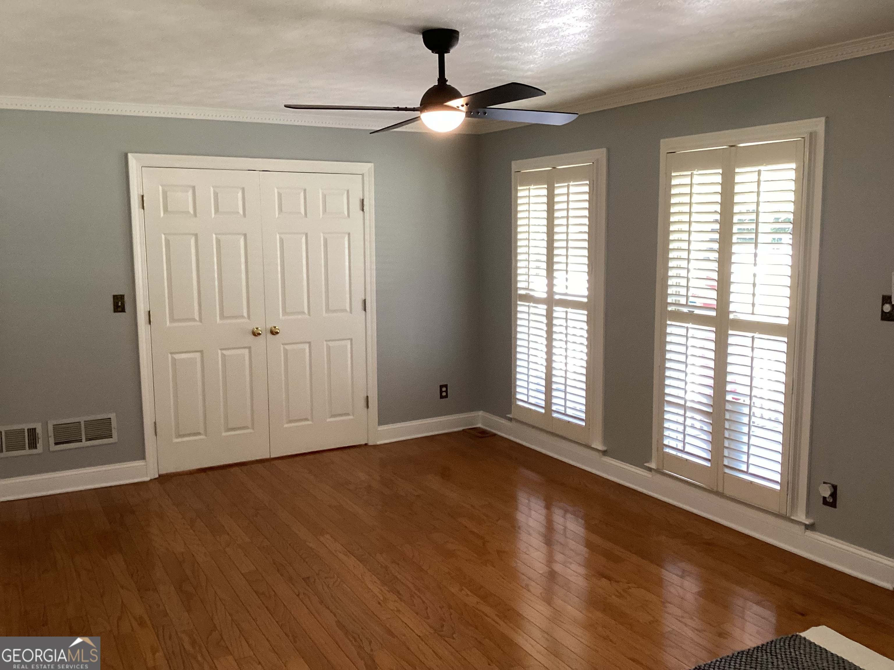 2779 Bob Cox Road Marietta, GA 30064 - Photo 21 of 48 wooden floor in an empty room with a window