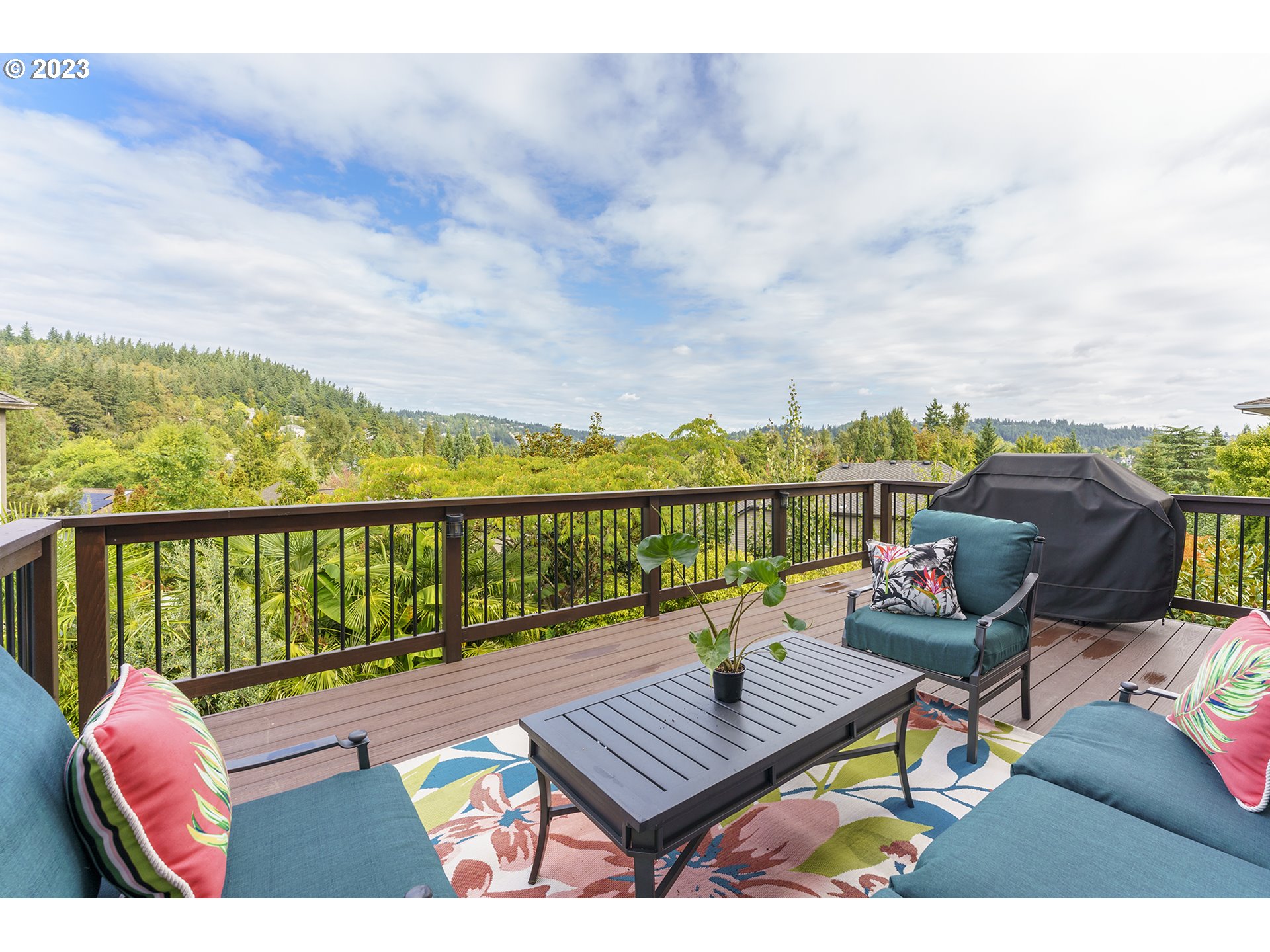 11561 Southeast Highland Loop Clackamas, OR 97015 - Photo 13 of 36 a view of a chairs and table on the terrace