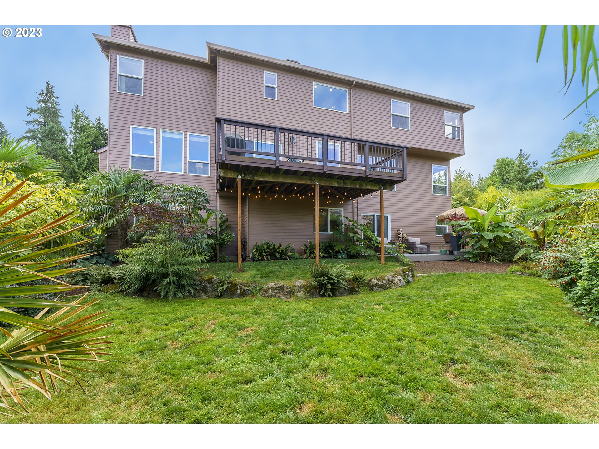 11561 Southeast Highland Loop Clackamas, OR 97015 - Photo 14 of 36 a view of a backyard with plants