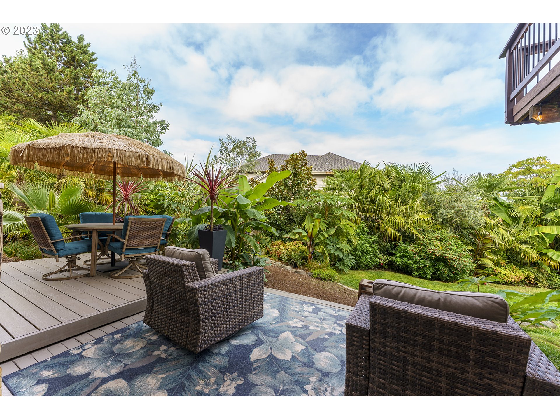 11561 Southeast Highland Loop Clackamas, OR 97015 - Photo 26 of 36 a backyard of a house with table and chairs
