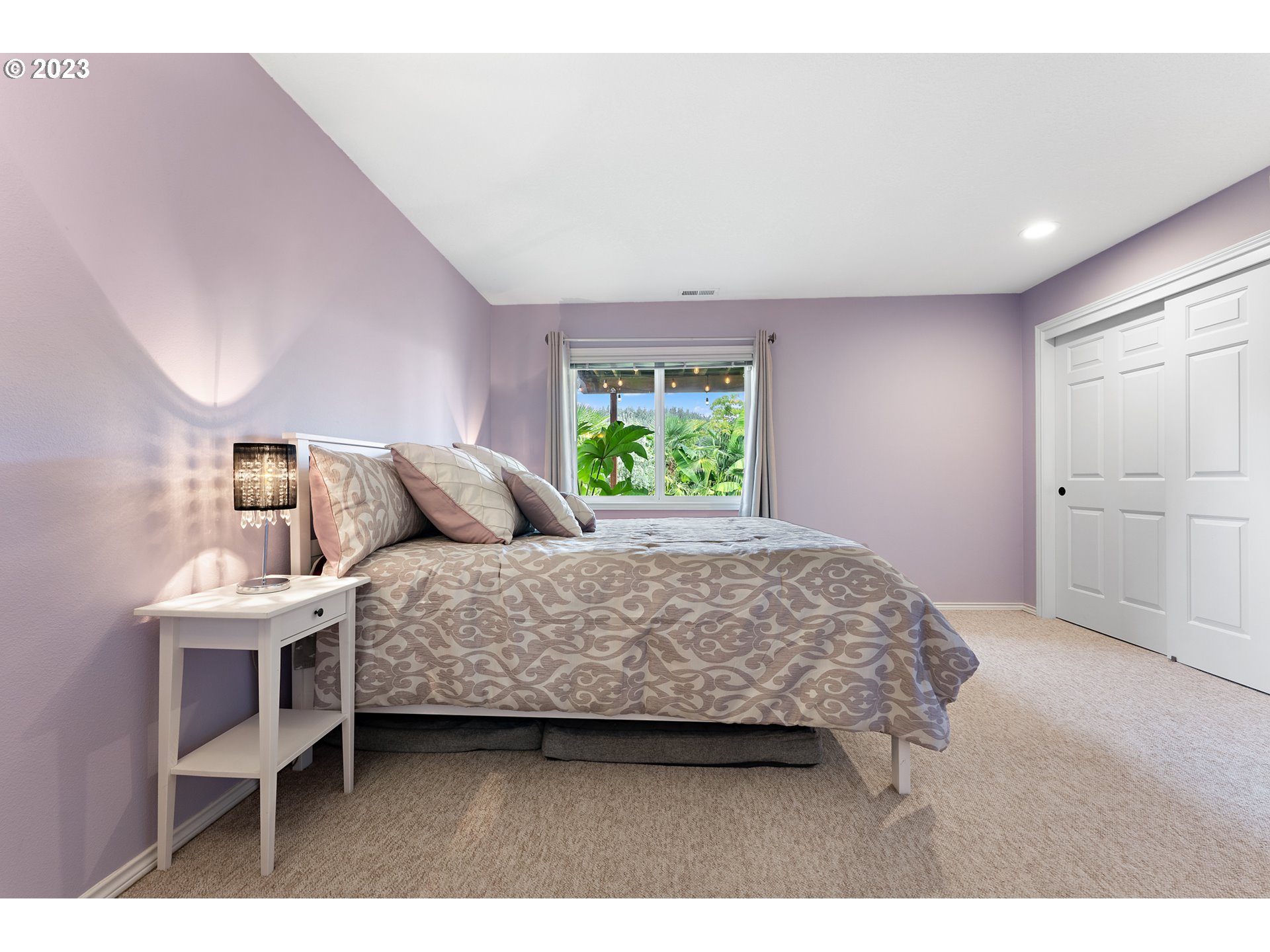 11561 Southeast Highland Loop Clackamas, OR 97015 - Photo 28 of 36 a bedroom with a bed and a window