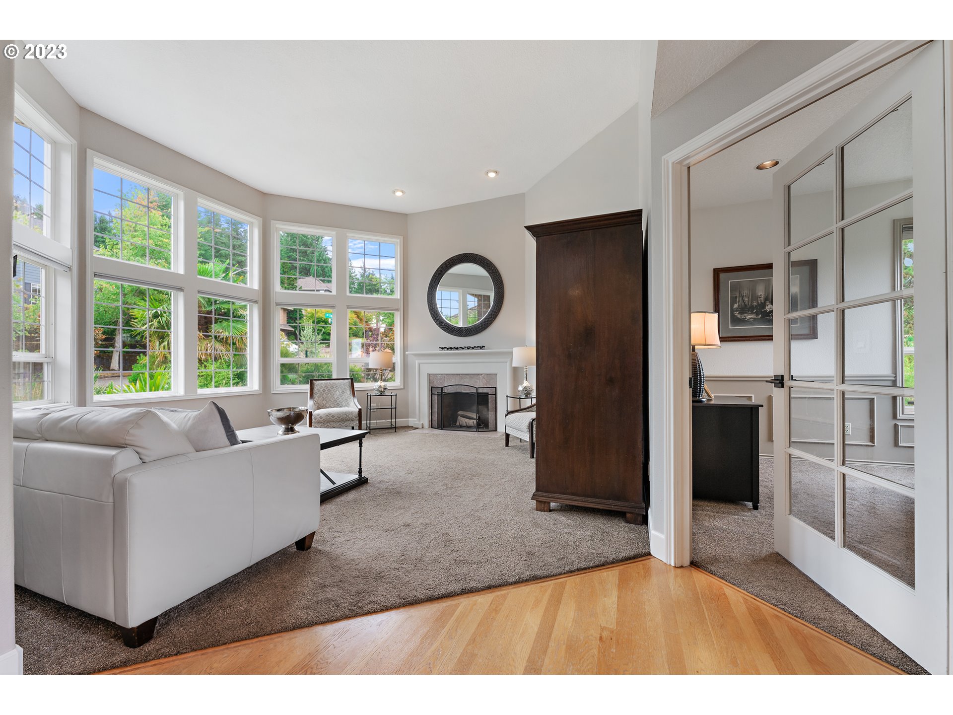 11561 Southeast Highland Loop Clackamas, OR 97015 - Photo 3 of 36 a living room with furniture and a fireplace