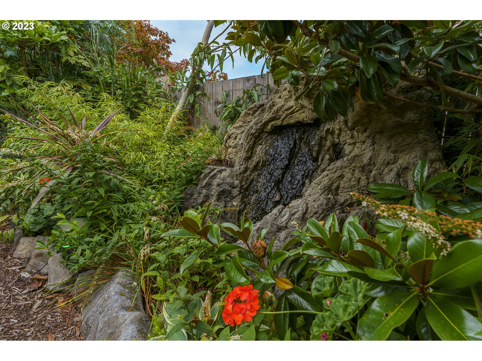 11561 Southeast Highland Loop Clackamas, OR 97015 - Photo 33 of 36 a backyard of a house with lots of green space
