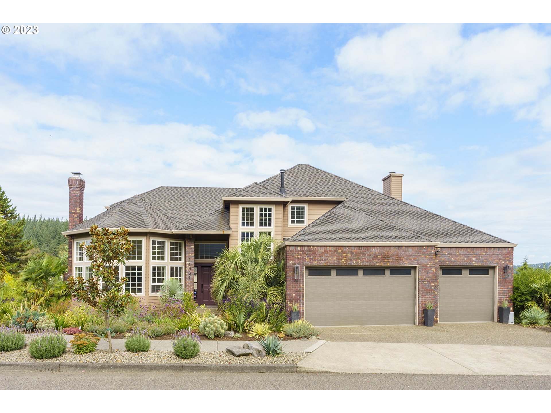 11561 Southeast Highland Loop Clackamas, OR 97015 - Photo 36 of 36 a front view of a house with a yard