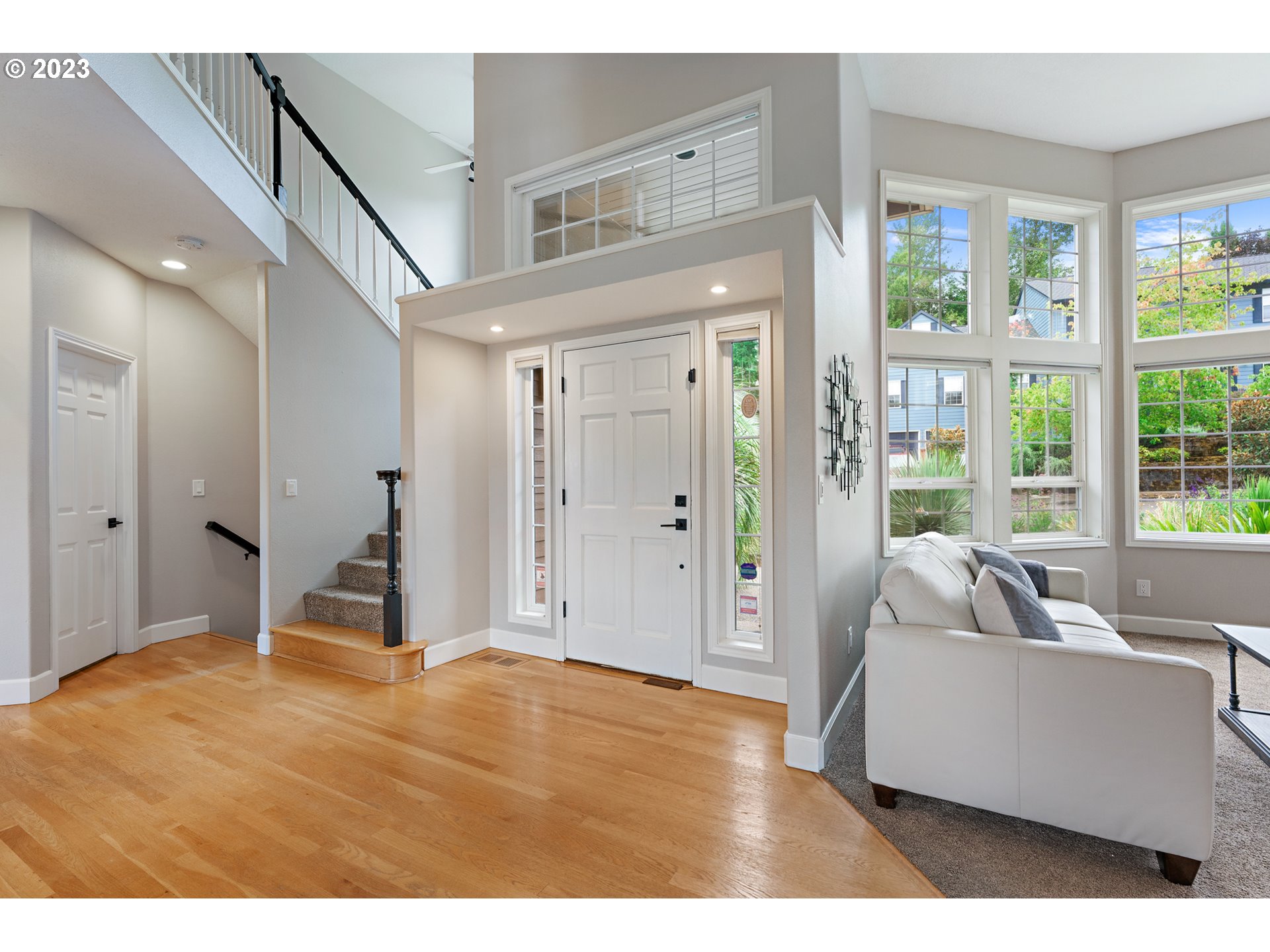 11561 Southeast Highland Loop Clackamas, OR 97015 - Photo 7 of 36 a bedroom with a bed and a large window