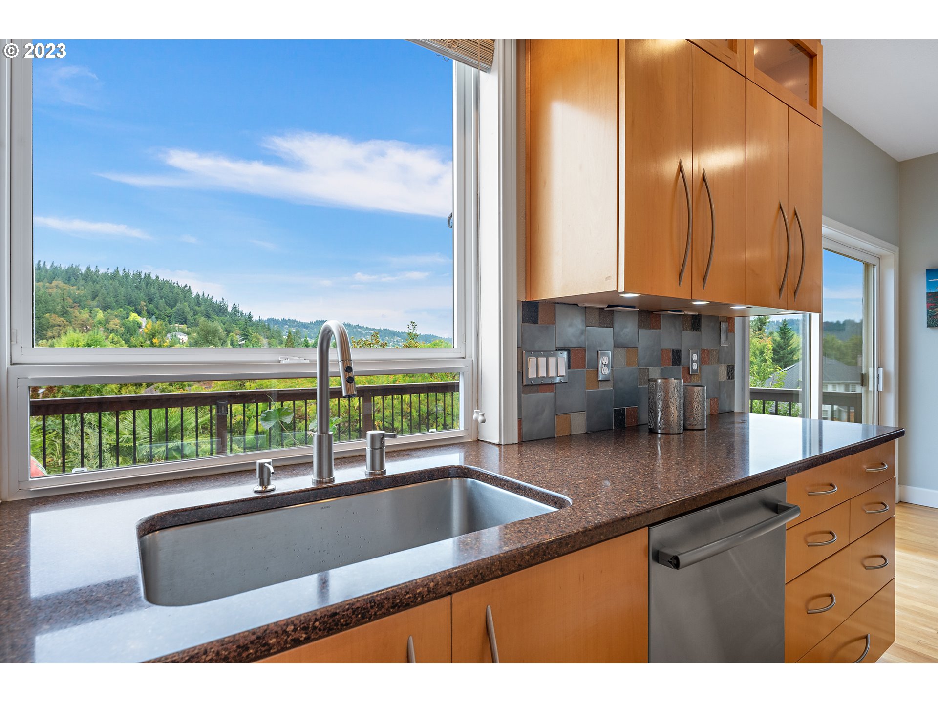 11561 Southeast Highland Loop Clackamas, OR 97015 - Photo 9 of 36 a view of kitchen with a sink and living room