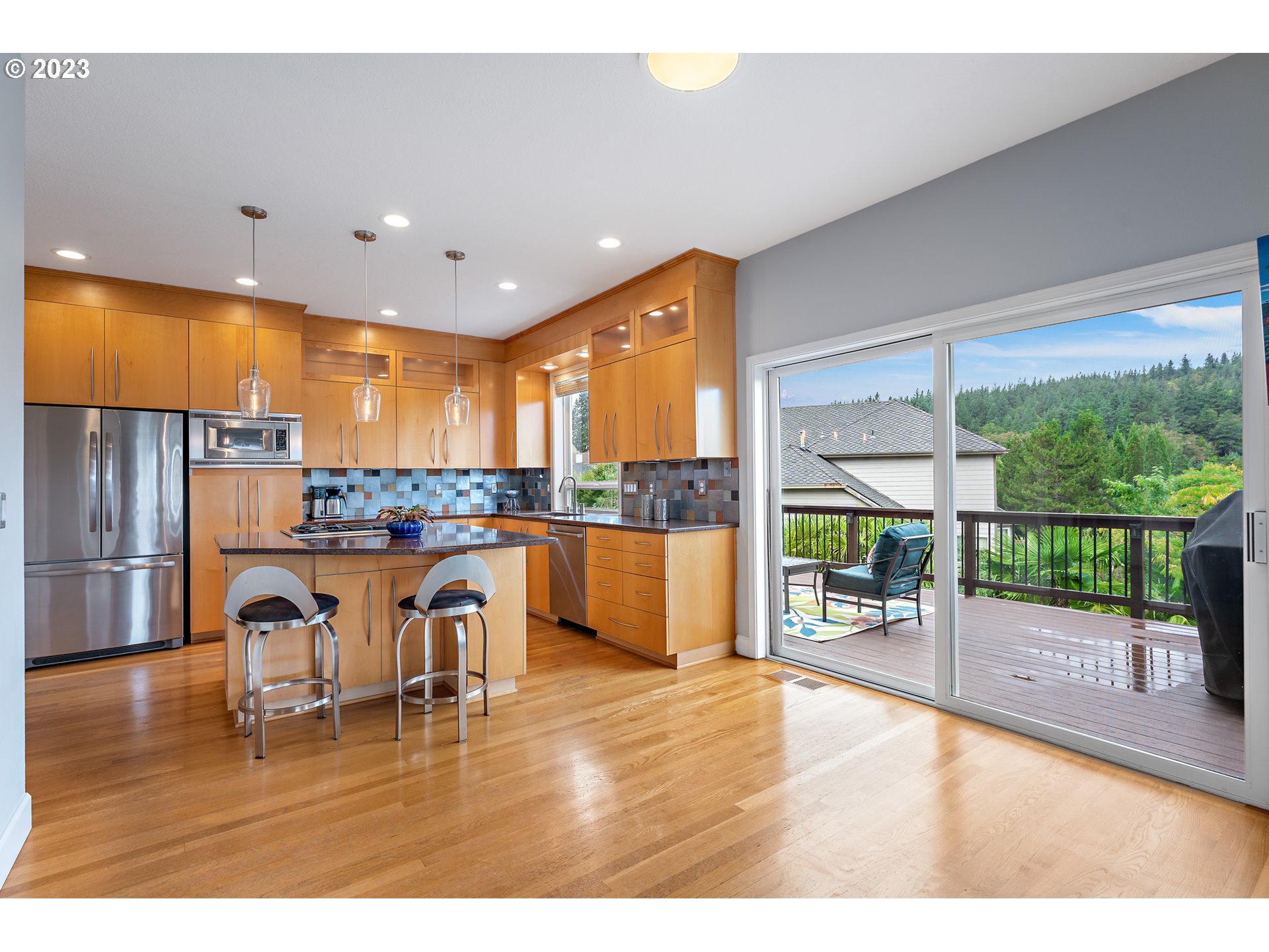 11561 Southeast Highland Loop Clackamas, OR 97015 - Photo 10 of 36 a kitchen with a table and chairs